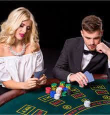 Live dealer studio broadcast showing blackjack, roulette, and baccarat tables with professional dealers and multi-camera HD angles